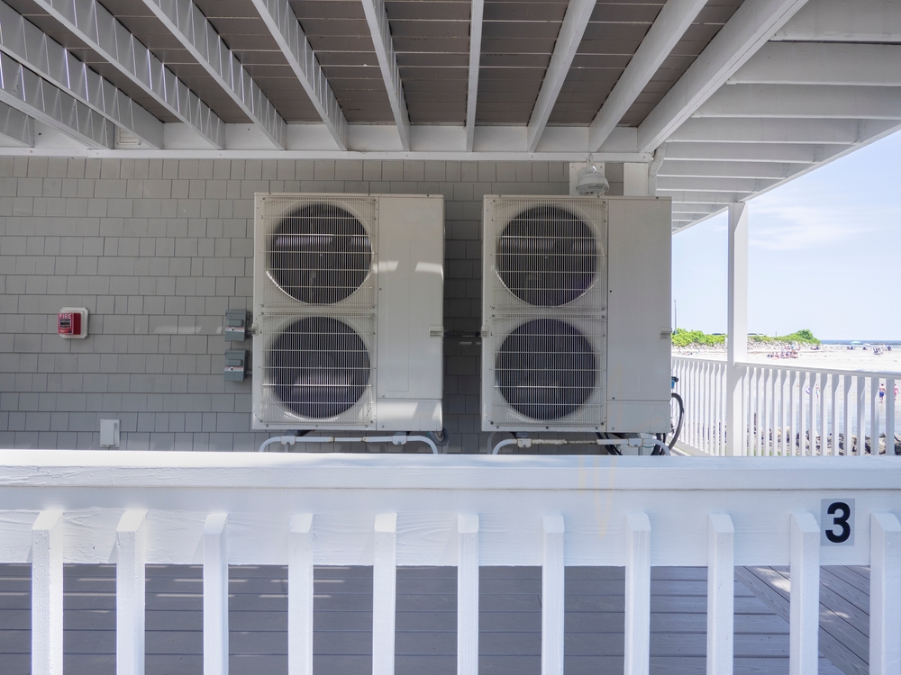 heat pump units outside a home on the beach